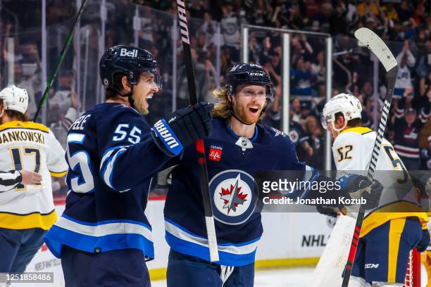Mark Scheifele and Kyle Connor of the Winnipeg Jets celebrate a second period goal against the Nashville Predators at Canada Life Centre on April 08,...