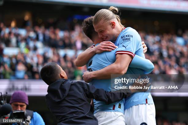 Erling Haaland celebrates with John Stones of Manchester City as celebrates after scoring a goal to make it 1-0 during the Premier League match...