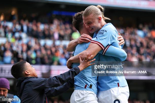 Erling Haaland celebrates with John Stones of Manchester City as celebrates after scoring a goal to make it 1-0 during the Premier League match...