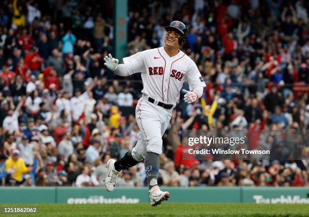 Yu Chang of the Boston Red Sox waves to his dugout as he round the bases after his two-run home run against the Los Angeles Angels during the fourth...