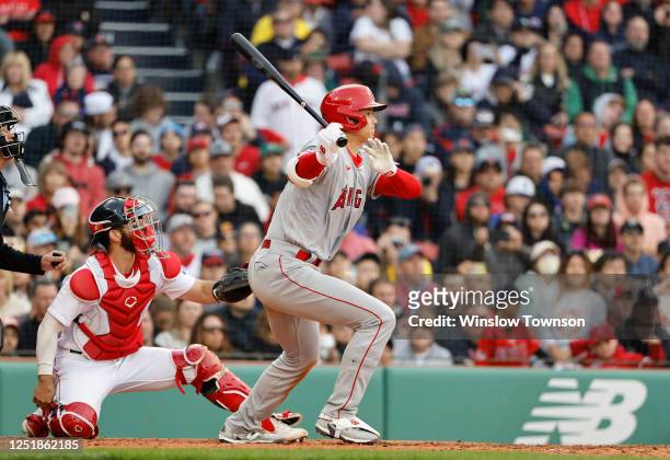 Shohei Ohtani of the Los Angeles Angels follows through on a single against the Boston Red Sox during the fifth inning at Fenway Park on April 15,...