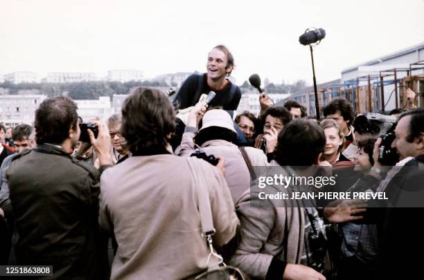 French oarsman Gérard d'Aboville is welcomed on September 21, 1980 in Brest harbor after he has completed his single-handed crossing of the Atlantic,...