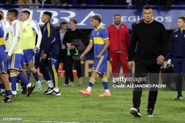 Boca Juniors' team coach Jorge Almiron leaves the field after losing 1-0 against Estudiantes during the Argentine Professional Football League...