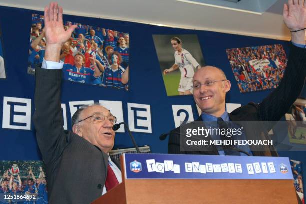 Jean-Pierre Escalettes, , president of the French Football Federation and French Sports Secretary of State Bernard Laporte gesture during a press...