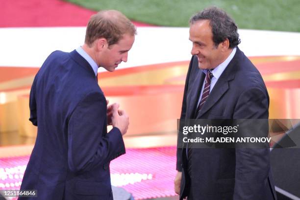 Head of the UEFA Michel Platini greets Britain's Prince William prior the UEFA football Champions League's final opposing FC Barcelona to Manchester...