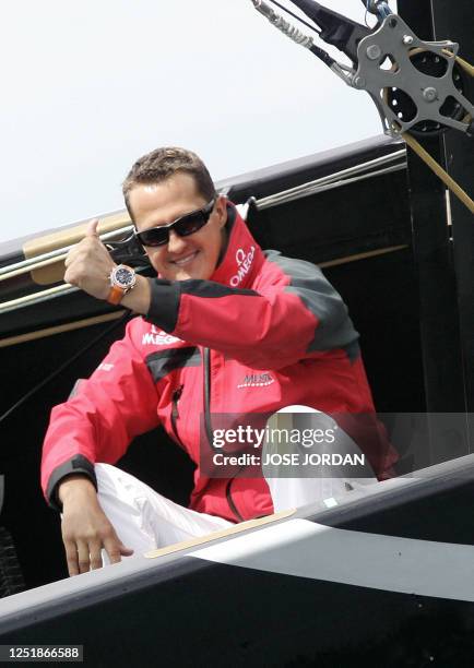 Former Formula 1 world champion Germany's Michael Suchmacher gives a thumbs up on Emirates Team New Zealand during Flight 3 of the Round Robin 2 of...