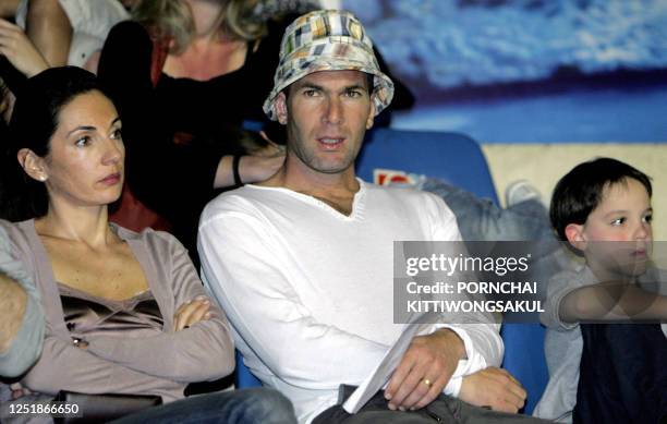 French footballer, Zinedine Zidane watches a Thai boxing match at a boxing stadium in Bangkok, 19 February 2007. Zidane, whose career ended with an...