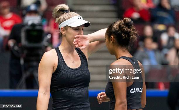 Gabriela Dabrowski and Leylah Annie Fernandez of Canada talk in between point during their doubles match against Kirsten Flipkens and Greet Minnen of...