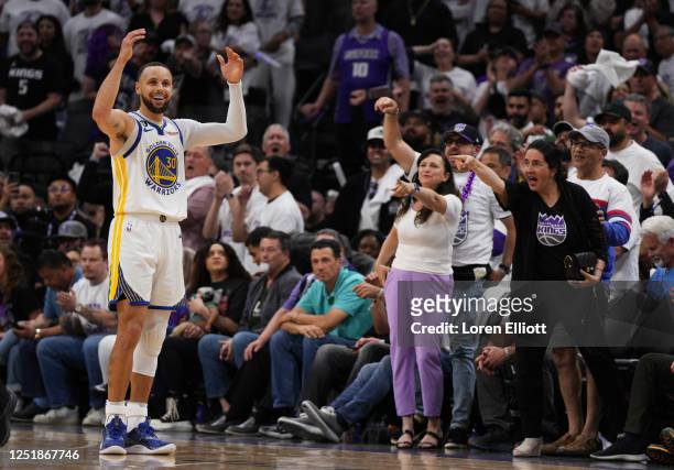 Stephen Curry of the Golden State Warriors reacts to a call during the fourth quarter of the game against the Sacramento Kings in Game One of the...