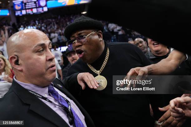 Earl Tywone Stevens Sr., known as the rapper E-40, yells at arena security personnel before being escorted from courtside seating during Game One of...