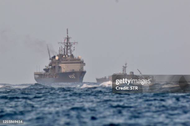 Japan Maritime Self-Defense Force vessels, including the submarine rescue ship Chihaya , search the waters off Miyakojima, Okinawa prefecture, where...