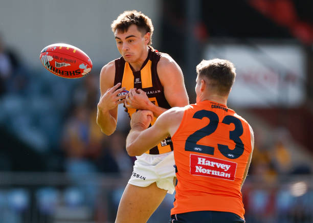 Seamus Mitchell of the Hawks and Jesse Hogan of the Giants in action during the 2023 AFL Round 05 match between the GWS Giants and the Hawthorn Hawks...