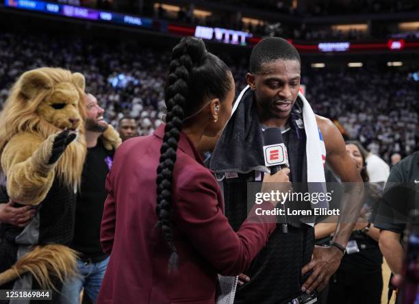 De'Aaron Fox of the Sacramento Kings is interviewed by Malika Andrews of ESPN after defeating the Golden State Warriors in Game One of the Western...