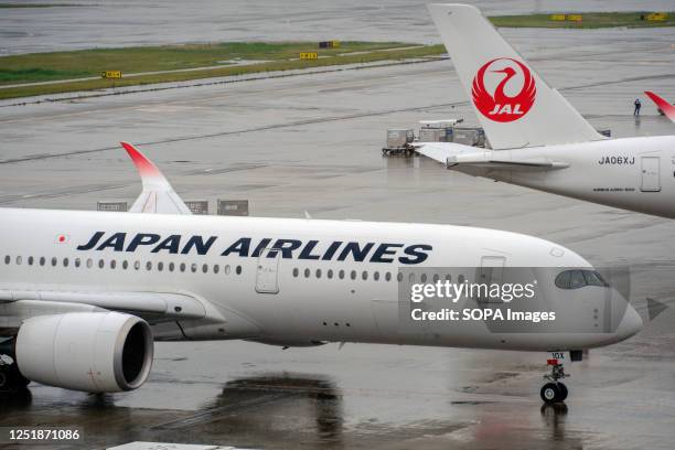 Japan Airlines airplanes seen at the Tokyo International Airport, commonly known as Haneda Airport in Tokyo.
