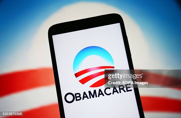 In this photo illustration, Obamacare logo is seen on a In this photo illustration, Obamacare logo is seen on a