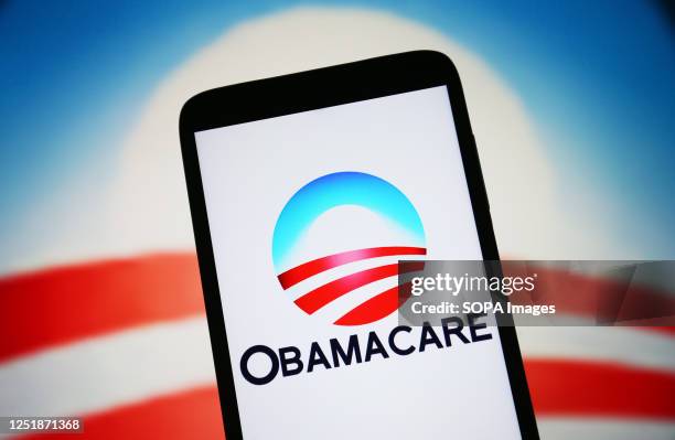 In this photo illustration, Obamacare logo is seen on a smartphone screen.