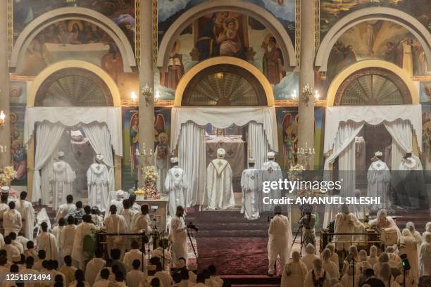 High priests pray during the celebration of Easter at Bole Medhanialem church in Addis Ababa, Ethiopia on April 16, 2023. - Ethiopian Easter, also...
