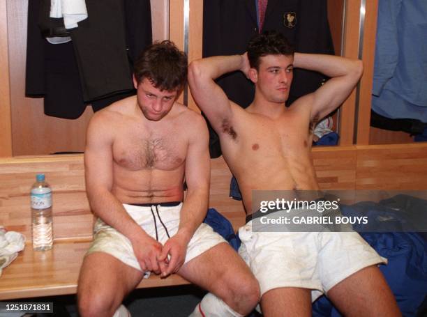 French center Franck Comba and winger Xavier Garbajosa look dejected after the France/Wales Five Nations tournament rugby match 06 Match at the Stade...