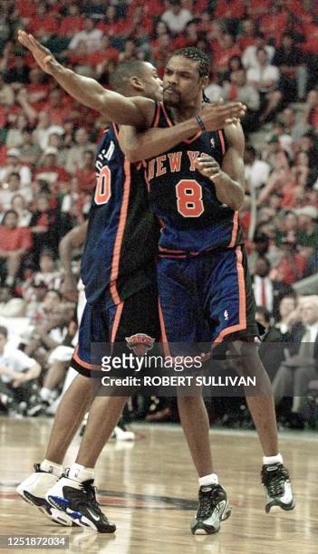 New York Knicks' Latrell Sprewell celebrates after a basket with teammate Allan Houston 08 May 1999 during game one of their first round play-off...