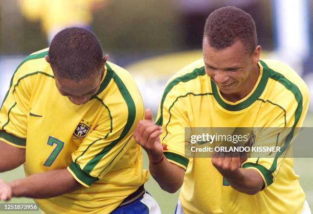Varley and Ronaldinho Gaucho of the Brazil Sub 23 team celebrate the eigth goal against Colombia 30 January 2000 in Londrina, Brazil. Varley y...