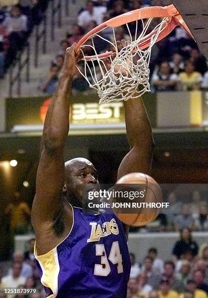 Shaq Rim Break Shaquille O'NeaL of the Los Angeles Lakers hangs on the rim after a ...