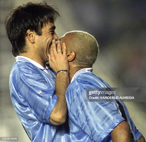 Players for Uruguay's select soccer team, Dario Silva and Alvaro Recoba celebrate the first goal for his team against Brazil, 28 June 2000, in a...