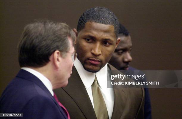 Baltimore Ravens linebacker Ray Lewis confers with attorney Ed Garland moments before pleading guilty to obstruction of justice in a double murder...