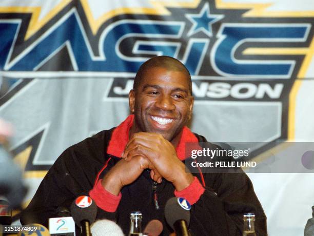 Earvin "Magic" Johnson flashes a bright smile at his press conference in Boraas, Western Sweden, 25 October 1999. The retired NBA star is in Sweden...