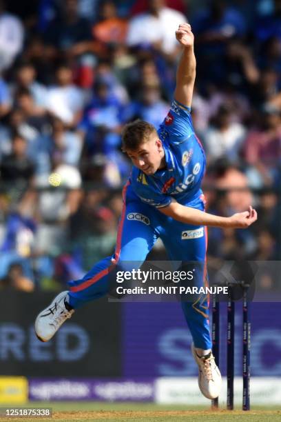 Mumbai Indians' Cameron Green bowls during the Indian Premier League Twenty20 cricket match between Kolkata Knight Riders and Mumbai Indians at the...