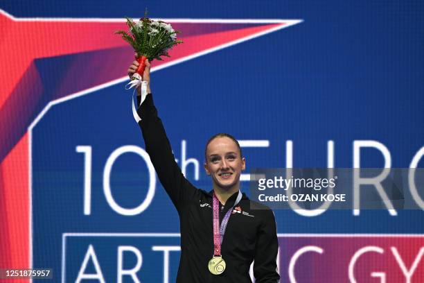 Gold medallist Netherlands' Sanne Wevers poses on the podium following the women's Blance Beam final at the 2023 Artistic Gymnastics European...