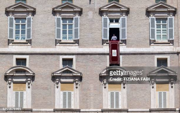 Pope Francis speaks from the window of the apostolic palace overlooking St. Peter's square during the Regina Caeli prayer on April 16, 2023 in The...