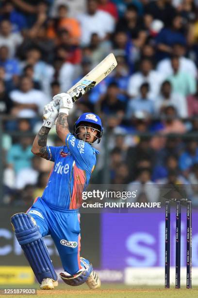 Mumbai Indians' Ishan Kishan watches the ball after playing a shot during the Indian Premier League Twenty20 cricket match between Kolkata Knight...