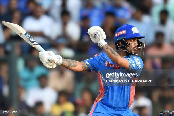 Mumbai Indians' Ishan Kishan watches the ball after playing a shot during the Indian Premier League Twenty20 cricket match between Kolkata Knight...