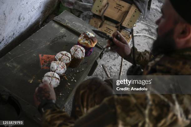 Ukrainian soldier prepares muffin on the frontline amid Russia-Ukraine war on Easter day in Donetsk Oblast, Ukraine on April 16, 2023.