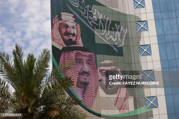 This picture shows a poster depicting King Abdulaziz bin Saud , the founder of the modern Kingdom of Saudi Arabia, King Salman bin Abdulaziz , and...