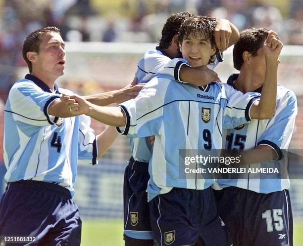 Argentine soccer player of Sub 20 selection Alejandro Dominguez celebrates with his teammates their first goal against Bolivian selection during the...