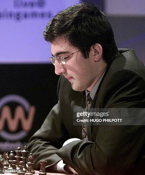 The challenger Vladimir Kramnik of Russia palying against compatriot Garry Kasparov stares at his pieces in the15th game of the world chess...