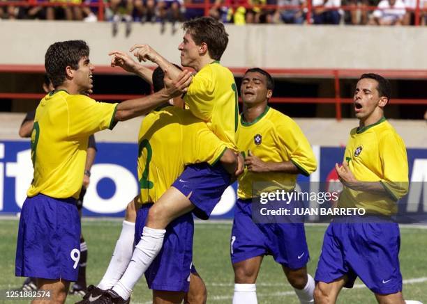 The soccer players of Brazilian selection , Juninho, Cafu, Juninho Paulista, Romario and Euller celebrate their second goal against Venezuela during...