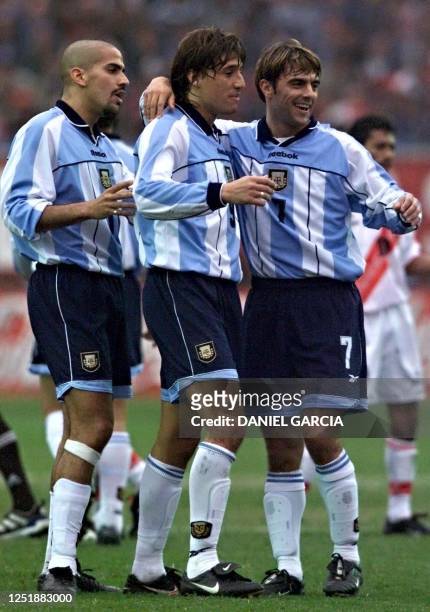 Argentine players Claudio Lopez , Hernan Crespo and Juan Sebastian Veron celebrate their first goal against Peru at the National Stadium in Lima,...