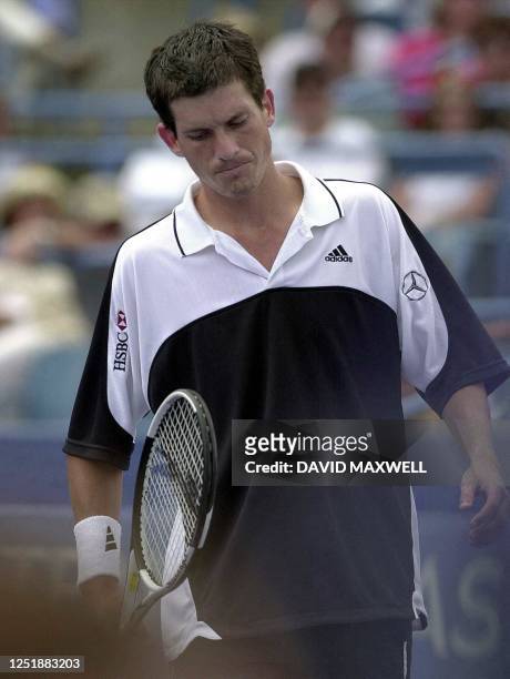 Tim Henman of England exits the court following his loss to Thomas Enqvist of Sweden in the championship match 13 August 2000 at the 2000 Tennis...