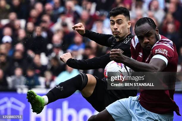 Arsenal's Brazilian midfielder Gabriel Martinelli kicks the ball that will touch the hand of West Ham United's English midfielder Michail Antonio...