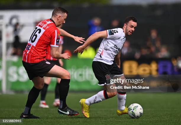 Louth , Ireland - 16 April 2023; Robbie Benson of Dundalk in action against Shane McEleney of Derry City during the SSE Airtricity Men's Premier...