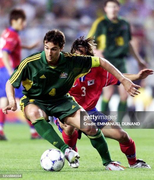 Australian football team captain Paul Okon fights for the ball with South Korean football player Choi Sung-Yong 03 June 2001 during the first group A...