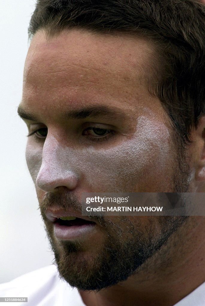 Patrick Rafter Arms Australian Patrick Rafter appears well prepared for a sunny day at ...