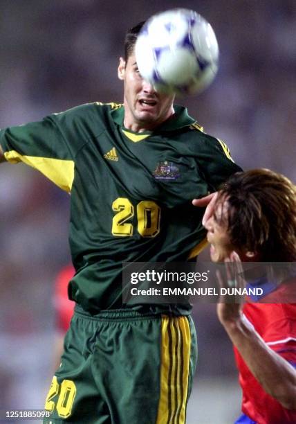 Australian football player Clayton Zane heads the ball past South Korea's Kim Tae-Young 03 June 2001 during the first group A match of the FIFA...