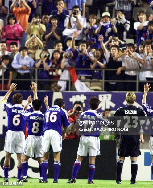 Japanese players acknowledge the cheer of their fans after their group B match against Brazil at Kashima Stadium in FIFA's Confederations Cup in...