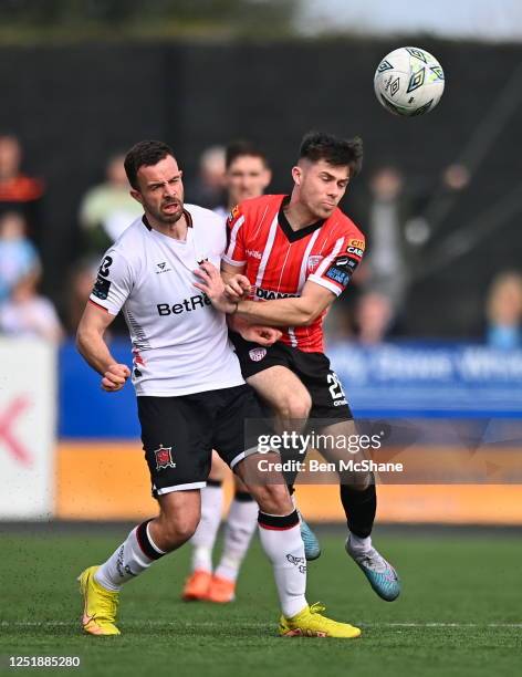 Louth , Ireland - 16 April 2023; Adam O'Reilly of Derry City in action against Robbie Benson of Dundalk during the SSE Airtricity Men's Premier...