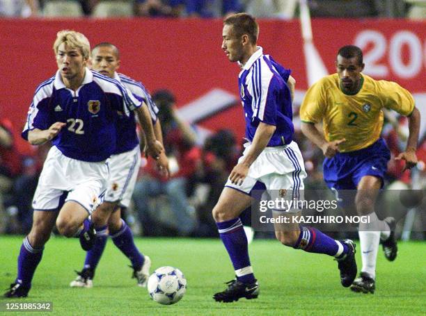 Japanese player Hidetoshi Nakata takes control of the ball during the FIFA's Confederations Cup match against Brazil at Kashima Stadium, 100 km north...