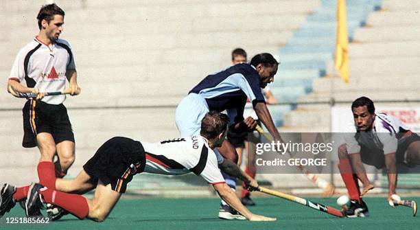 Indian team skipper BaljeetSingh Dhillon steals a ball from Michael Green the German teamskipper and florian keller at the Mayor RadhakrishnanStadium...