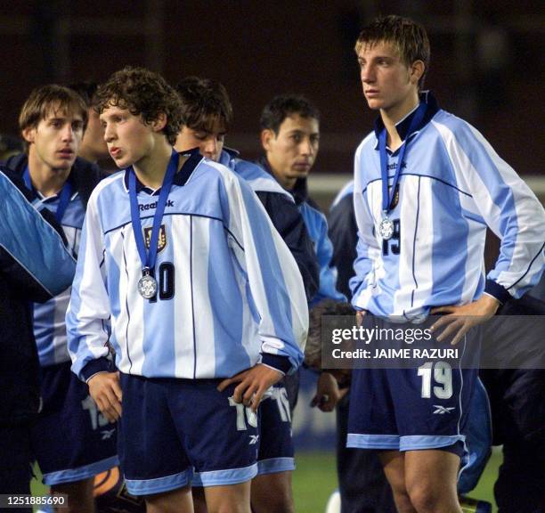 Argentine players Patricio Perez and Maximiliano Lopez of the SUB 17 soccer selection stand watching, after the team lost against Brazil and received...